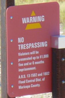 No trespassing sign at Tempe Cesspool for the Arts